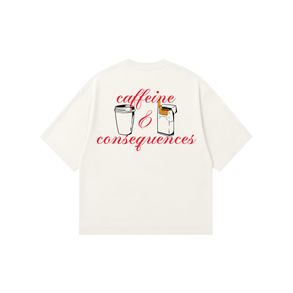 An off-white short-sleeve t-shirt with a graphic on the back depicting a coffee cup and a cigarette box with the red cursive text 'caffeine & consequences' on a plain white background.