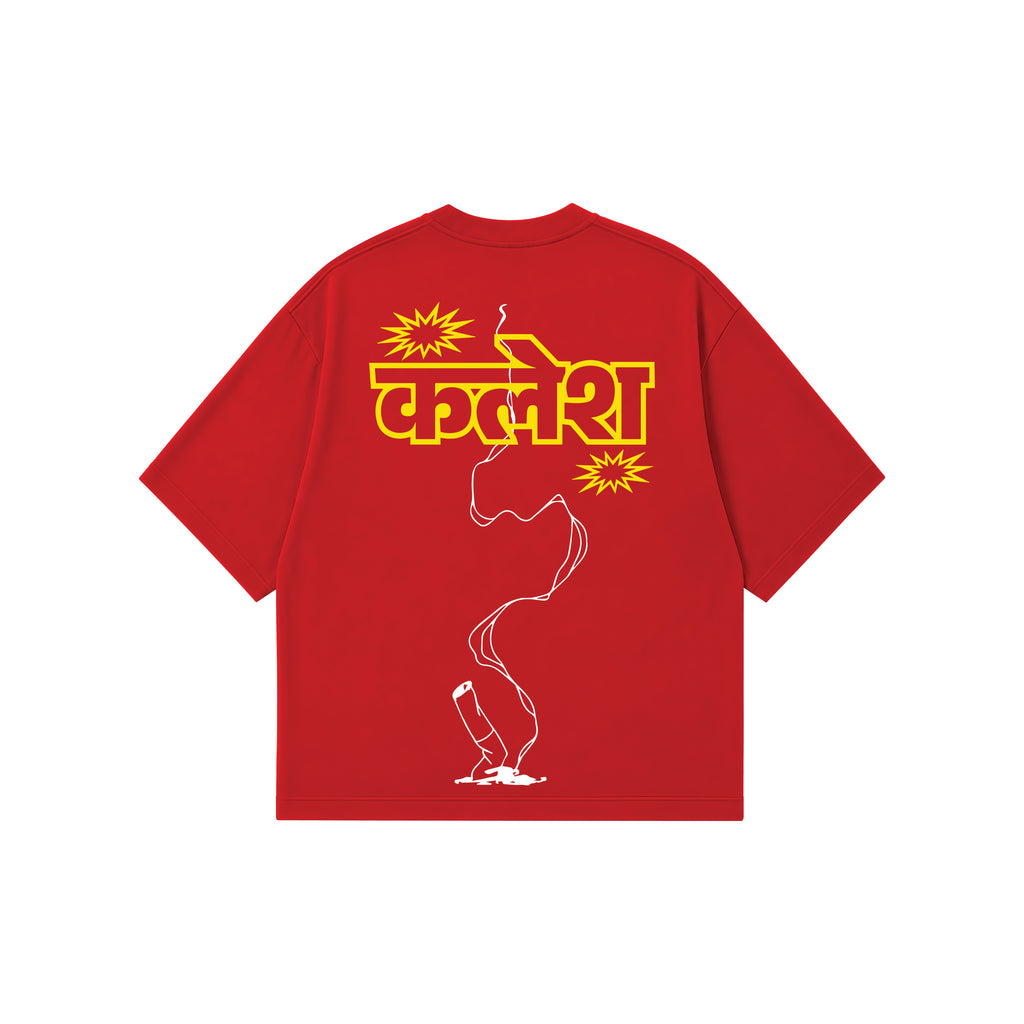 A red short-sleeve t-shirt with a graphic print on the back. The print features the Hindi word 'kalesh' in bold yellow letters, flanked by yellow starburst shapes, with a white outline of a lit cigarette running vertically down to a small white flame at the bottom.