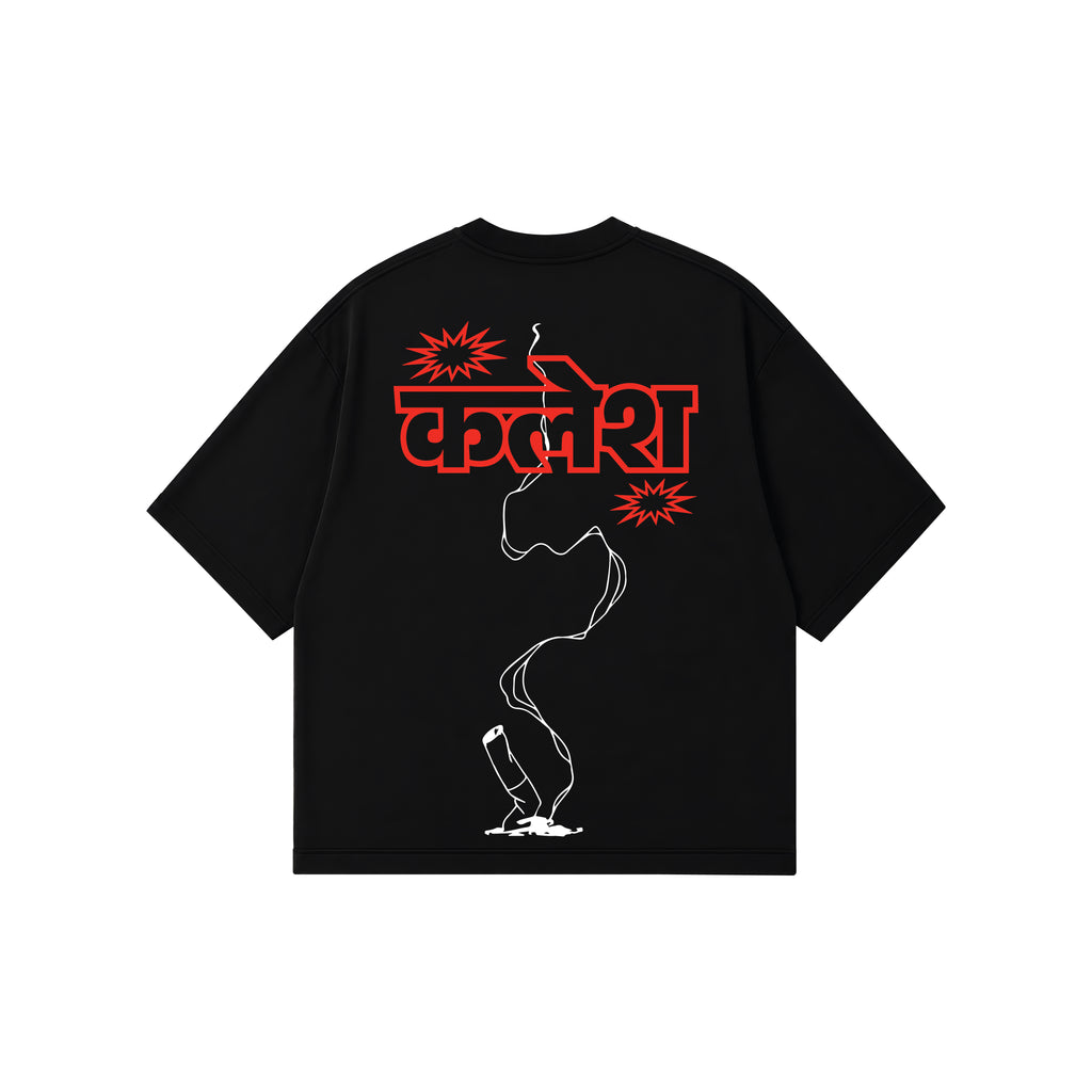 A black short-sleeve t-shirt with a graphic print on the back. The print features the Hindi word 'kalesh' in bold yellow letters, flanked by yellow starburst shapes, with a white outline of a lit cigarette running vertically down to a small white flame at the bottom.
