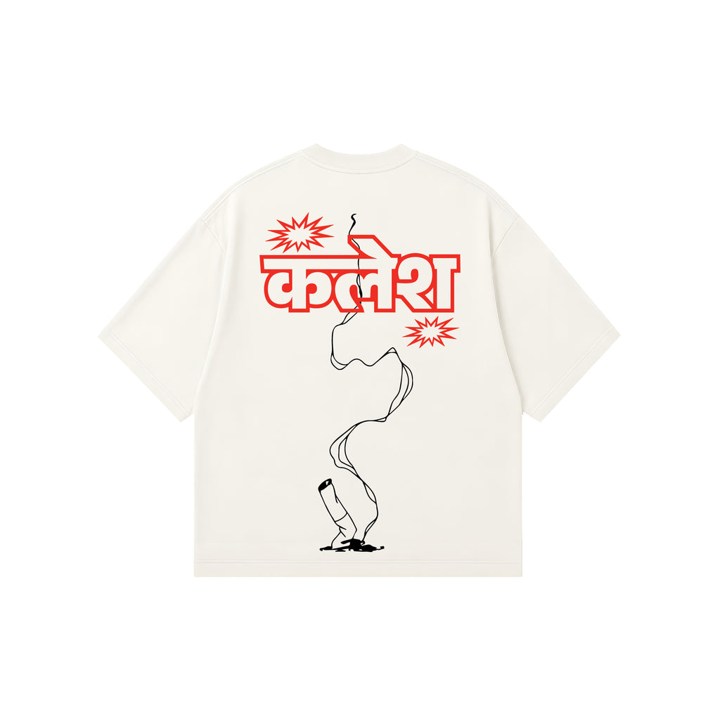 An off-white short-sleeve t-shirt with a graphic print on the back. The print features the Hindi word 'kalesh' in bold yellow letters, flanked by yellow starburst shapes, with a white outline of a lit cigarette running vertically down to a small white flame at the bottom.