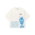 An off-white short-sleeve t-shirt by tangnt, featuring a blue graphic print of a skull and the words 'khatam jawani' on the front, with a small black 'tangnt' logo on the chest.