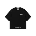 A black short-sleeve t-shirt with white text, featuring the brand name 'tangnt' on the left chest and 'we've all got one' printed near the bottom hem, displayed on a solid white background.